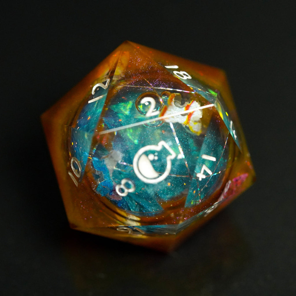Polyhedral dice with multicolored gemstone inlay on a black background