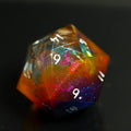 Multicolored polyhedral die on a black background