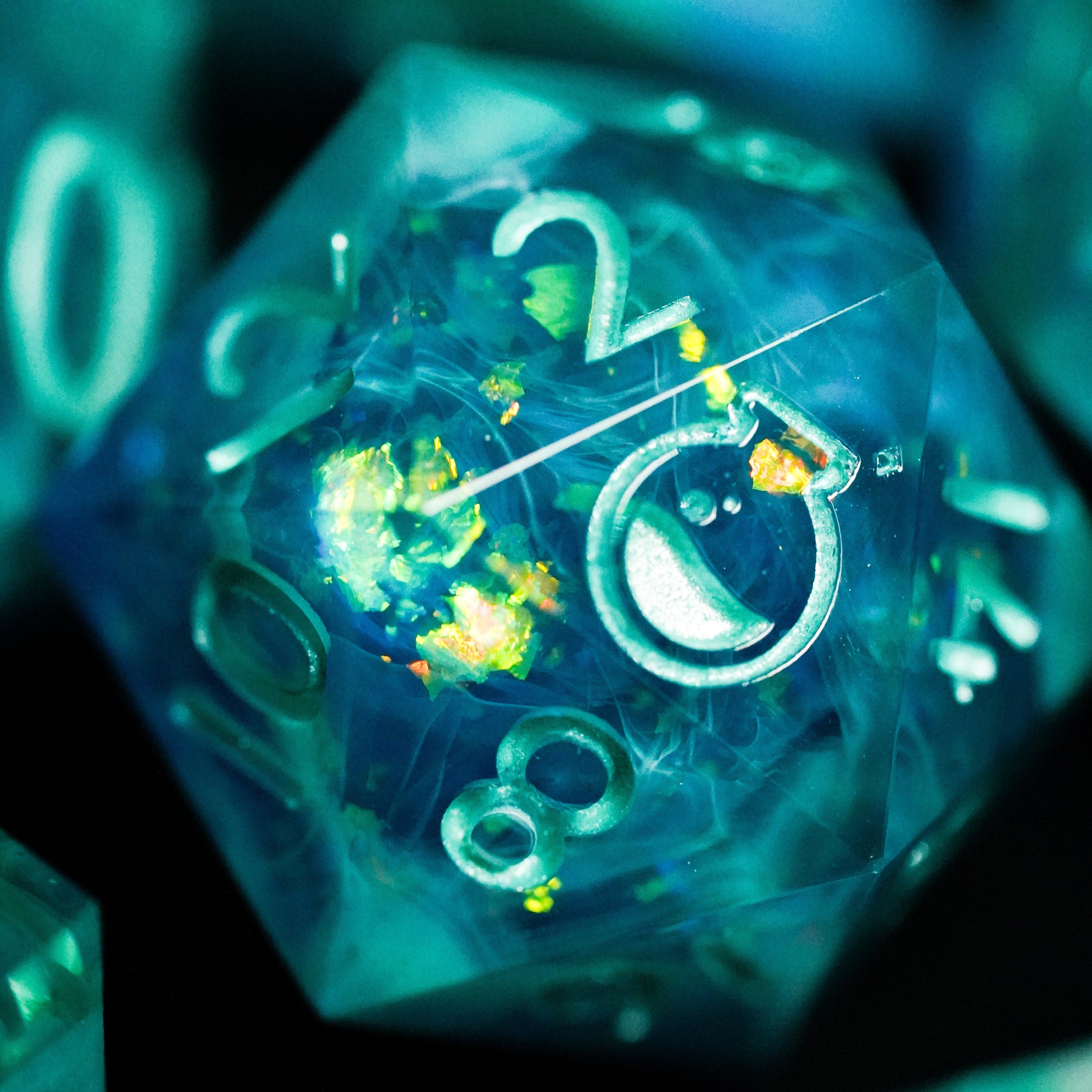 Close-up of a transparent dice with glowing numbers on a dark background