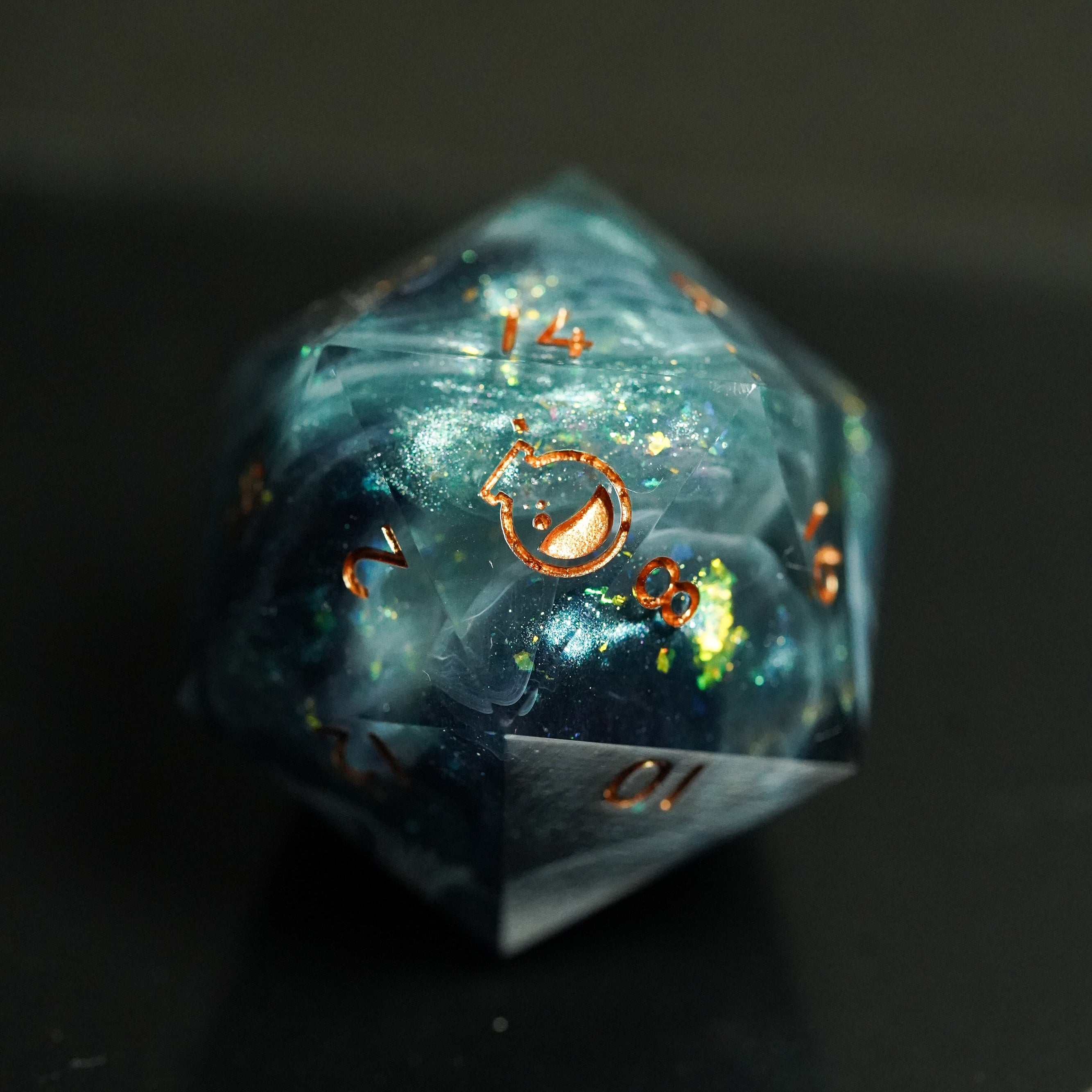 Translucent blue polyhedral dice with numbers on a dark background