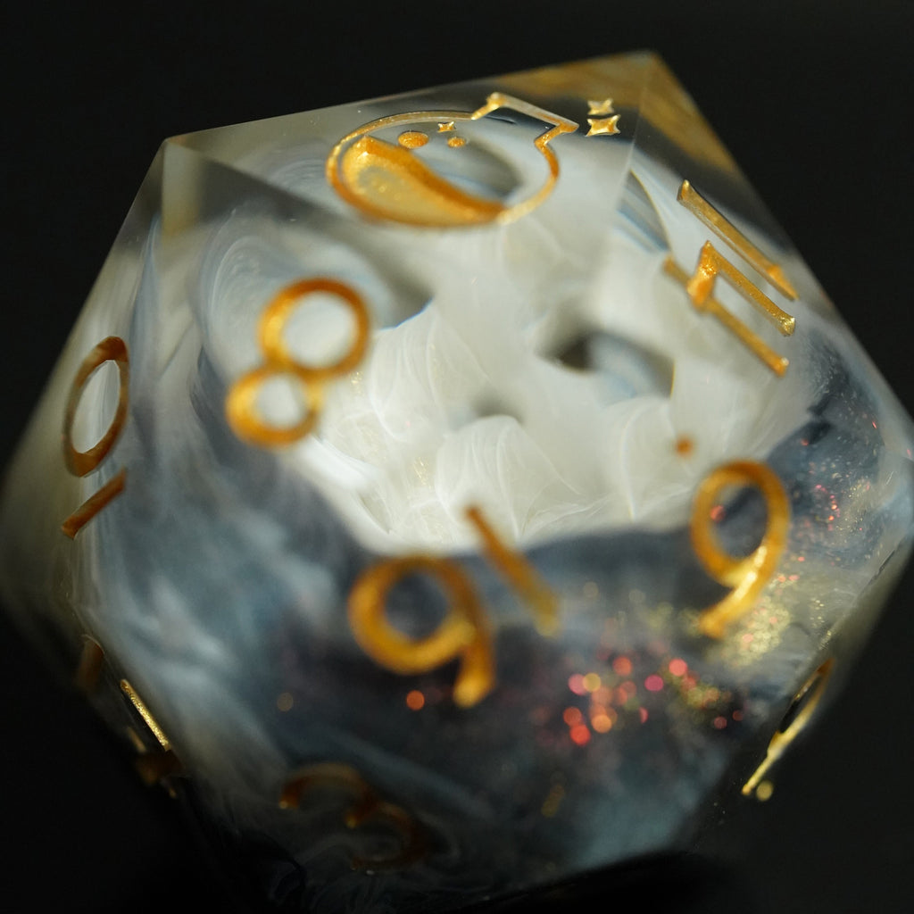 Translucent dice with gold numbers on a dark background