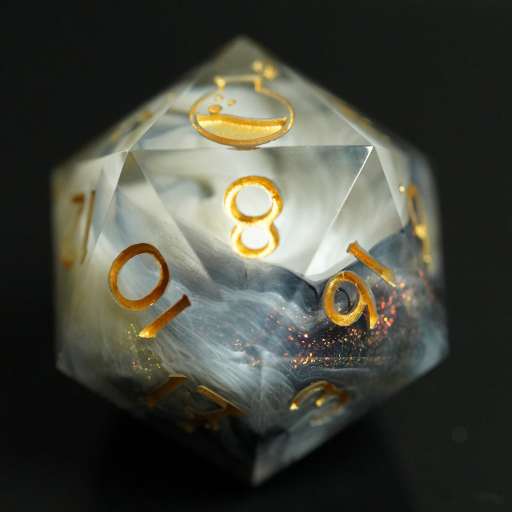 Translucent dice with gold numbering on a dark background